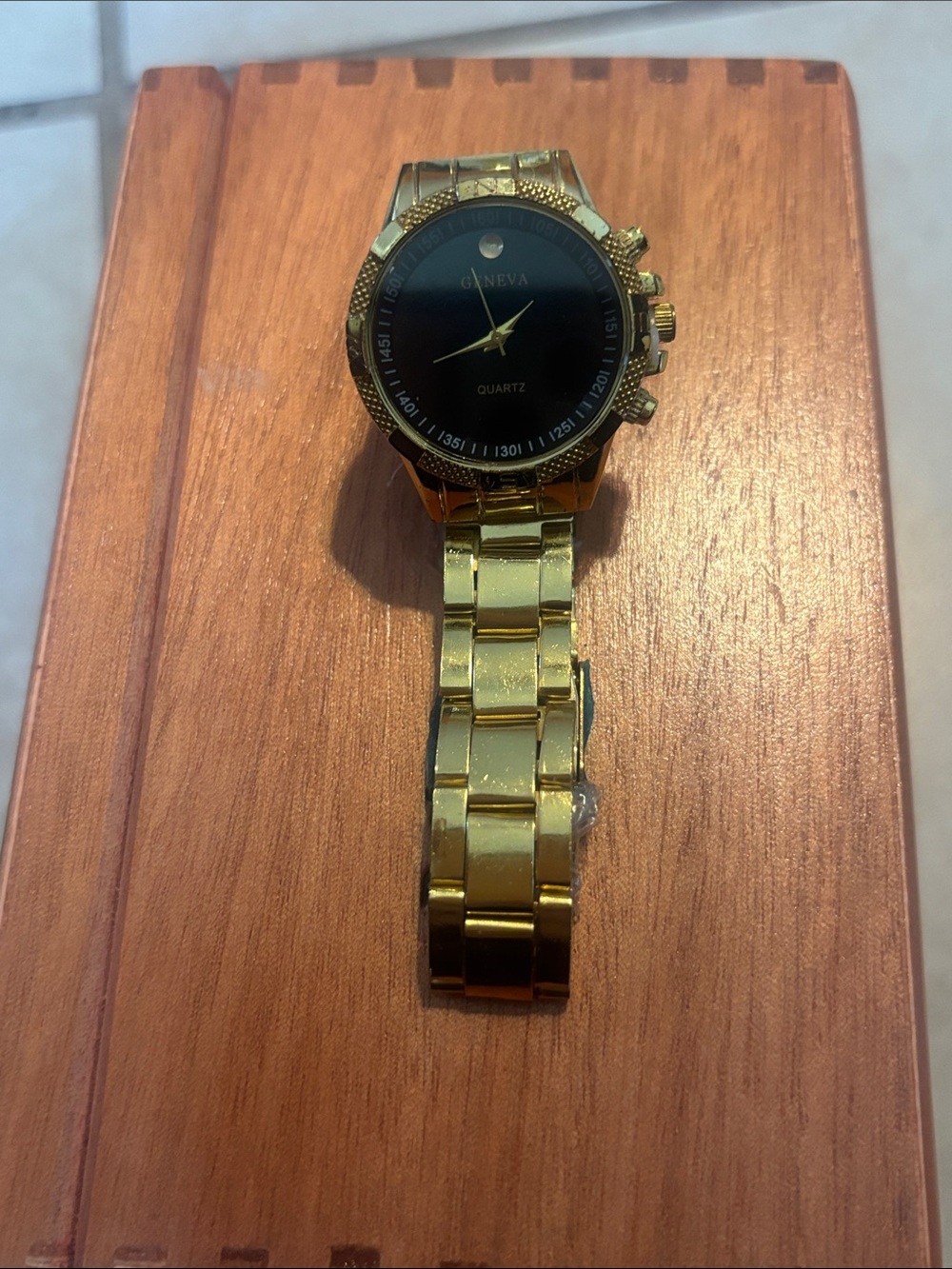 Geneva Gold Tone Watch with Black Dial